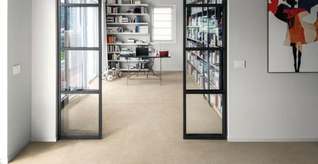 beige stone tile floor in a modern office space